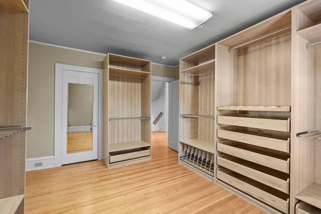 spacious closet with wood finished floors