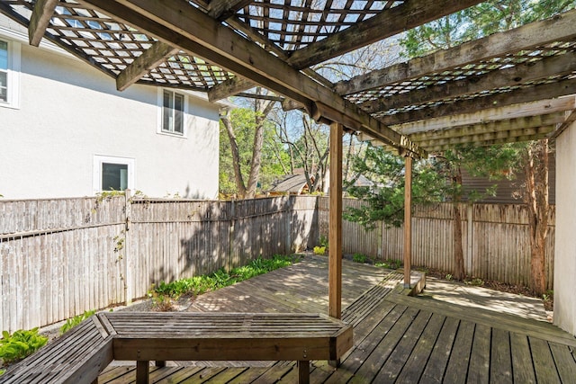 wooden deck featuring a fenced backyard and a pergola