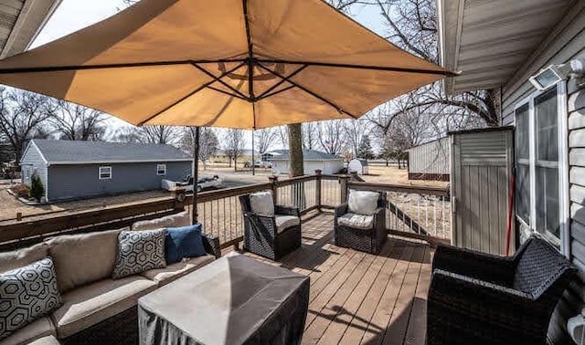 wooden terrace with an outdoor hangout area