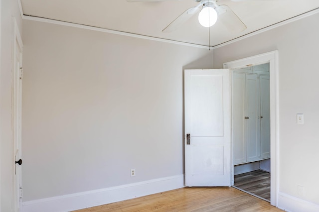 unfurnished bedroom featuring baseboards, ceiling fan, and light wood finished floors