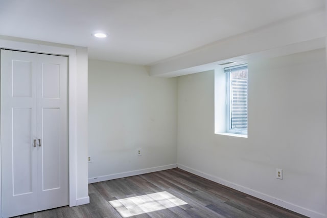 unfurnished bedroom featuring wood finished floors, visible vents, baseboards, recessed lighting, and a closet