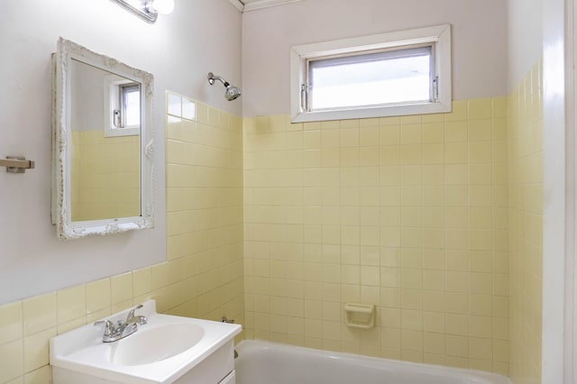 full bathroom with vanity, shower / bathtub combination, and a wealth of natural light