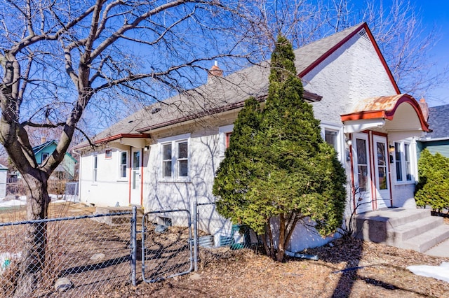 view of front of house with fence