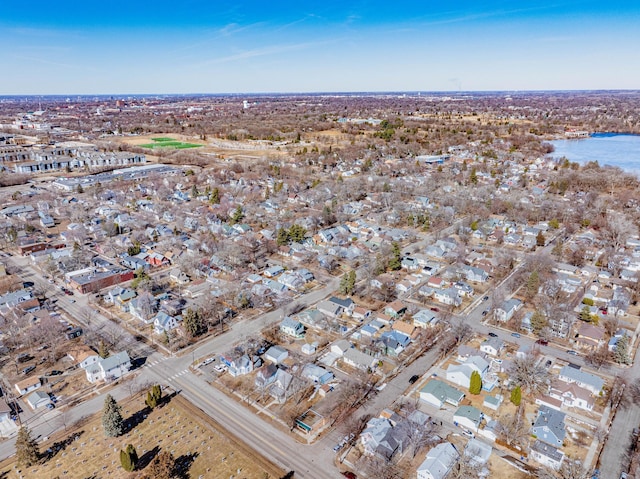 birds eye view of property featuring a residential view and a water view