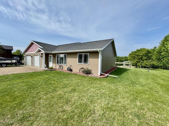 32406 Starland Shore Dr, Dent, MN 56528 - single story home featuring gravel driveway, a front yard, an attached garage, and roof with shingles
