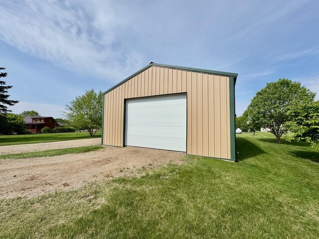 32406 Starland Shore Dr, Dent, MN 56528 - detached garage featuring driveway