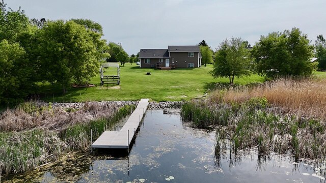 32406 Starland Shore Dr, Dent, MN 56528 - dock area featuring a water view and a lawn