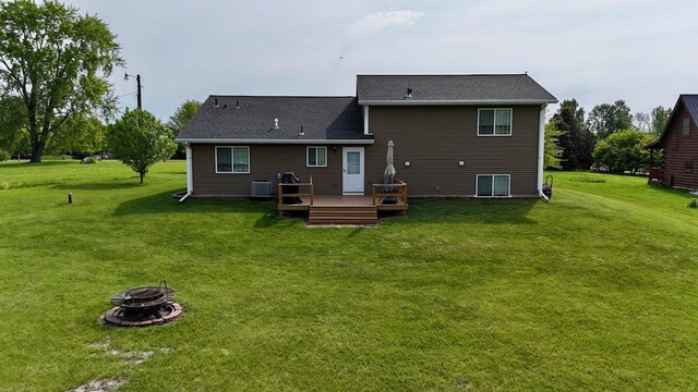 32406 Starland Shore Dr, Dent, MN 56528 - back of property with an outdoor fire pit, a deck, and a yard