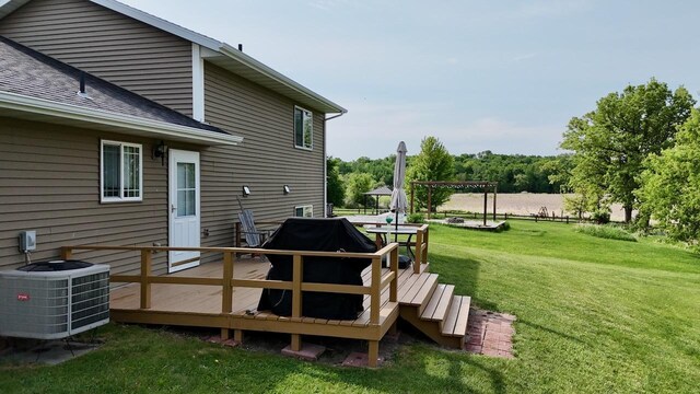 32406 Starland Shore Dr, Dent, MN 56528 - deck featuring central AC unit, a lawn, and area for grilling