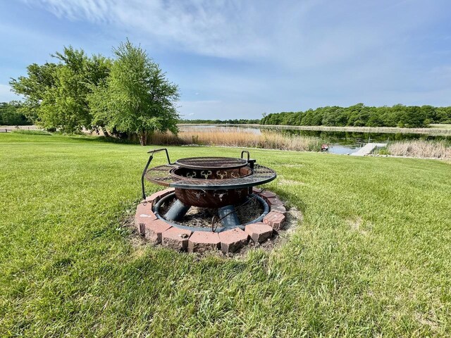 32406 Starland Shore Dr, Dent, MN 56528 - view of grassy yard with a fire pit and a water view