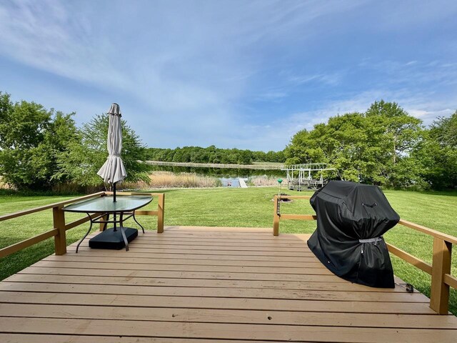 32406 Starland Shore Dr, Dent, MN 56528 - wooden deck with a water view, a yard, view of scattered trees, and area for grilling