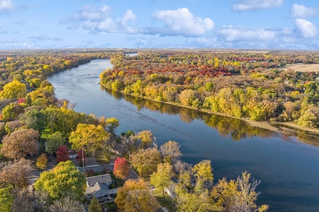 birds eye view of property featuring a view of trees and a water view