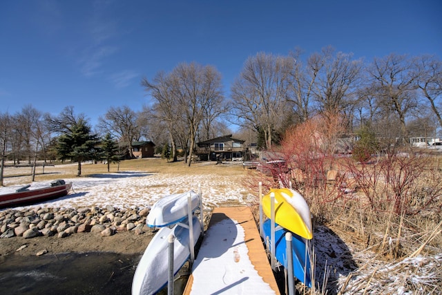 view of yard featuring a boat dock