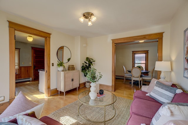 2538 Jefferson St NE, Minneapolis, MN 55418 - living area with a baseboard radiator, light wood finished floors, and wainscoting