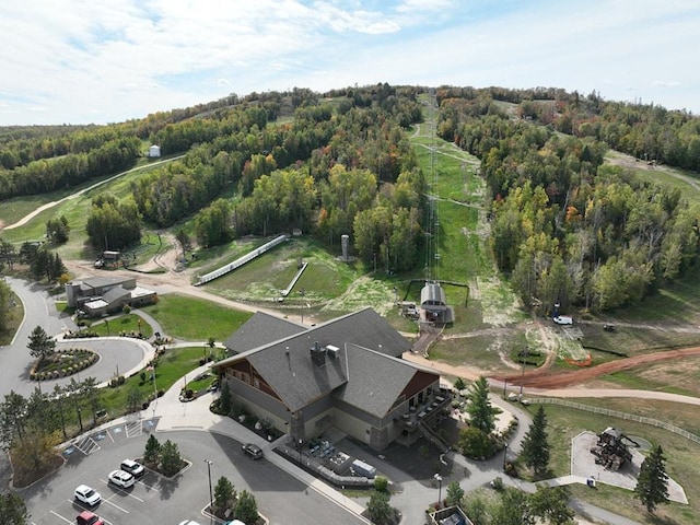 bird's eye view featuring a wooded view