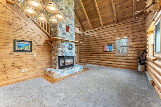 unfurnished living room with beam ceiling, high vaulted ceiling, rustic walls, carpet floors, and wood ceiling