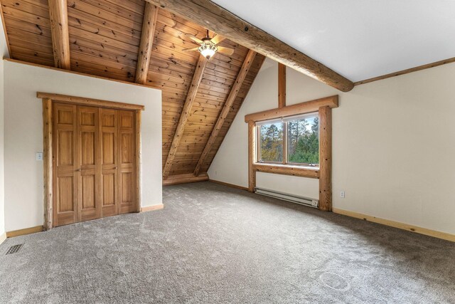 additional living space with a baseboard heating unit, lofted ceiling with beams, carpet, and baseboards