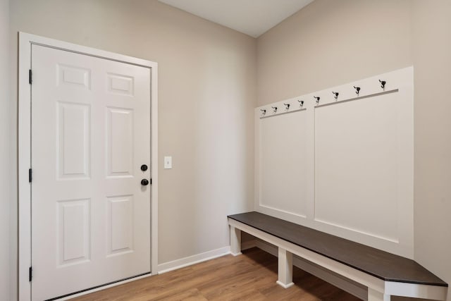 mudroom with baseboards and light wood-style floors