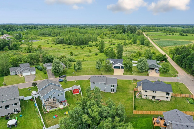 bird's eye view featuring a wooded view