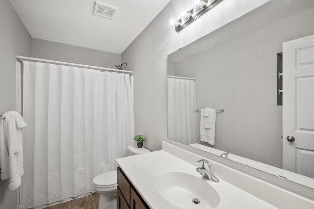 bathroom featuring vanity, a shower with curtain, visible vents, a textured ceiling, and toilet