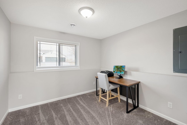 office space featuring electric panel, baseboards, carpet floors, and a textured ceiling