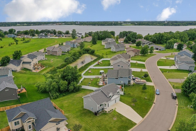 bird's eye view with a residential view and a water view