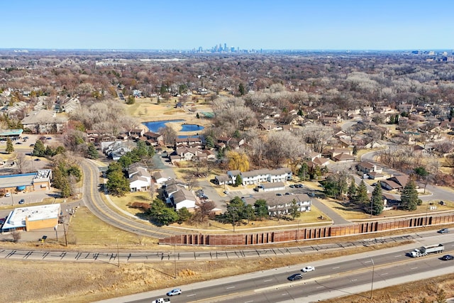 aerial perspective of suburban area with a nearby body of water