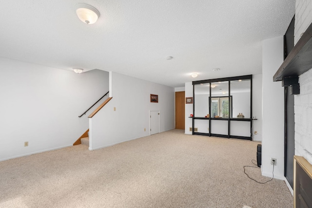 basement with light carpet, stairs, and a fireplace