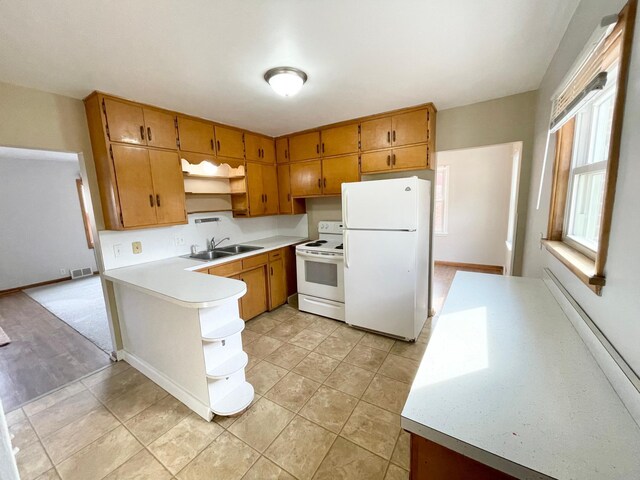 421 Van Dusen St, Springfield, MN 56087 - kitchen with white appliances, open shelves, a sink, and light countertops