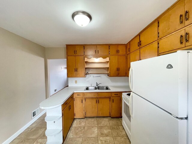 421 Van Dusen St, Springfield, MN 56087 - kitchen featuring white appliances, a sink, open shelves, light countertops, and a peninsula