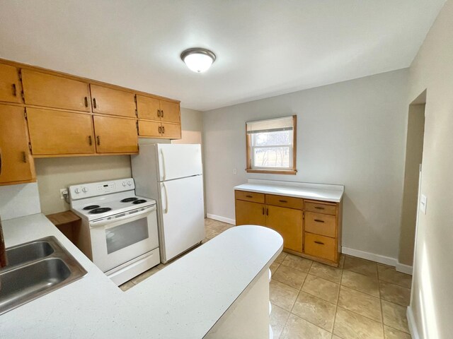 421 Van Dusen St, Springfield, MN 56087 - kitchen featuring white appliances, a sink, light countertops, and baseboards