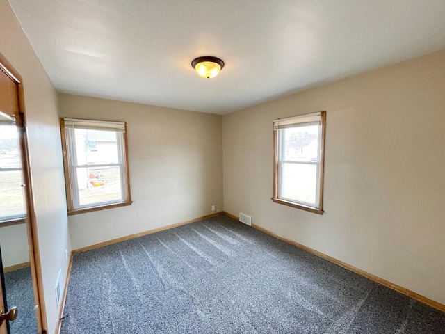 421 Van Dusen St, Springfield, MN 56087 - carpeted empty room featuring baseboards
