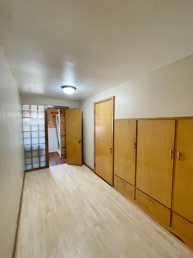 421 Van Dusen St, Springfield, MN 56087 - unfurnished bedroom featuring light wood-type flooring and baseboards