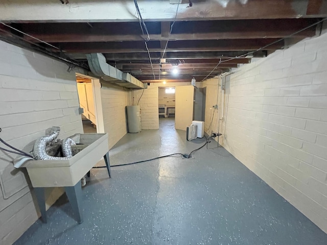 421 Van Dusen St, Springfield, MN 56087 - unfinished below grade area with water heater and a sink