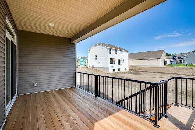 wooden terrace with a residential view