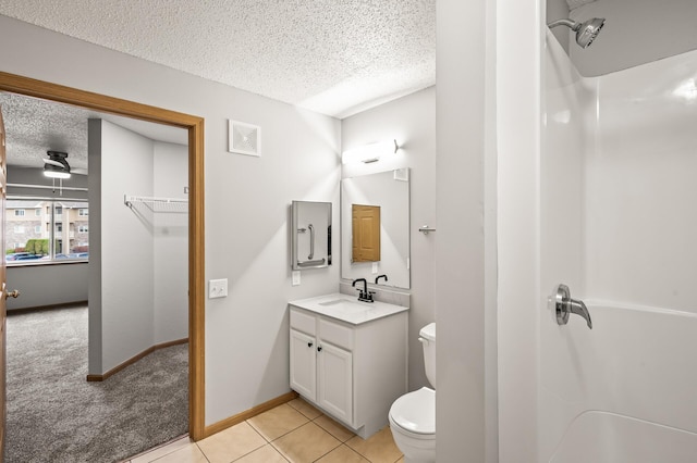 bathroom with visible vents, toilet, a textured ceiling, tile patterned flooring, and vanity