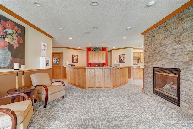 kitchen featuring recessed lighting, light colored carpet, a textured ceiling, and ornamental molding