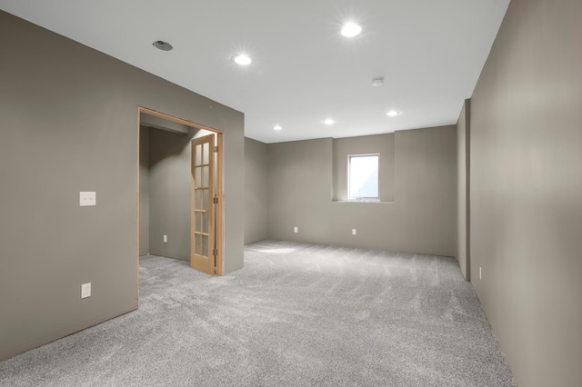 below grade area with carpet flooring and recessed lighting