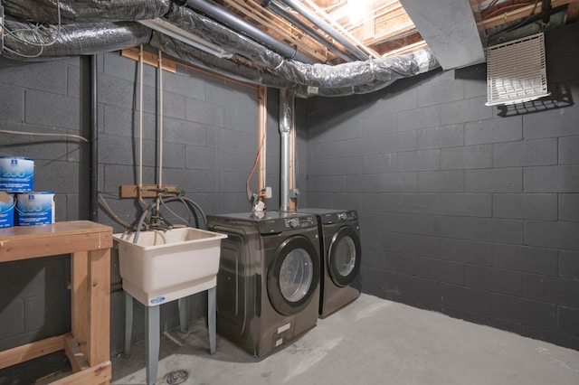 clothes washing area featuring independent washer and dryer and laundry area