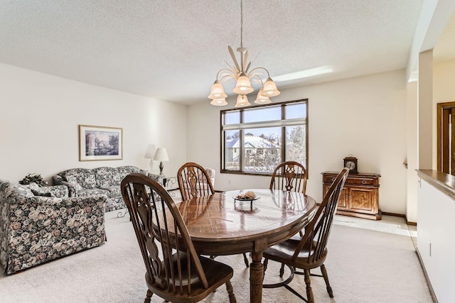 dining space with light carpet, a chandelier, and a textured ceiling