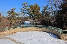 snow covered pool with fence