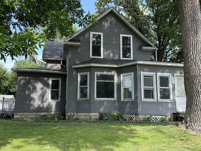 902 Pacific Ave, Kerkhoven, MN 56252 - view of side of property with a yard and roof with shingles