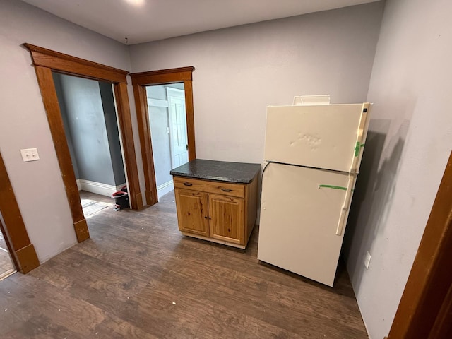 902 Pacific Ave, Kerkhoven, MN 56252 - kitchen featuring freestanding refrigerator, dark wood finished floors, and dark countertops