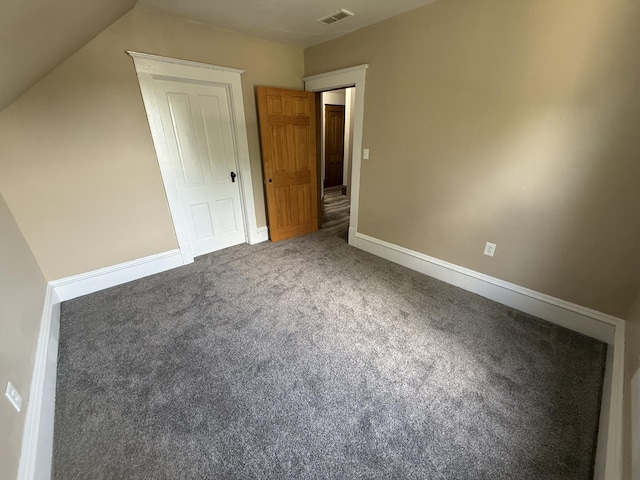 902 Pacific Ave, Kerkhoven, MN 56252 - unfurnished bedroom featuring carpet floors and lofted ceiling