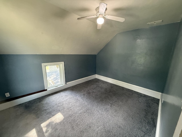 902 Pacific Ave, Kerkhoven, MN 56252 - additional living space featuring dark carpet, lofted ceiling, and a ceiling fan