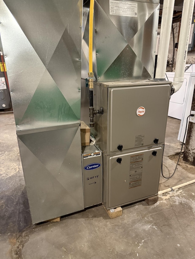 902 Pacific Ave, Kerkhoven, MN 56252 - utilities with water heater and washer / clothes dryer