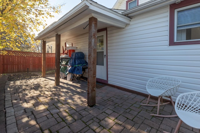 view of patio / terrace featuring fence