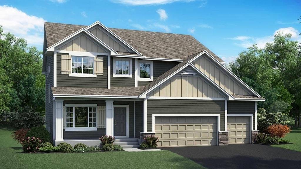 craftsman-style house featuring a garage, board and batten siding, driveway, and a shingled roof