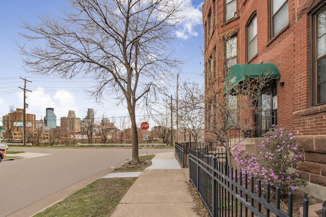 view of property's community featuring fence