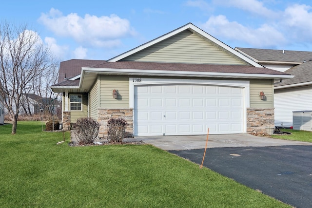 view of front of home with stone siding, driveway, an attached garage, and a front yard